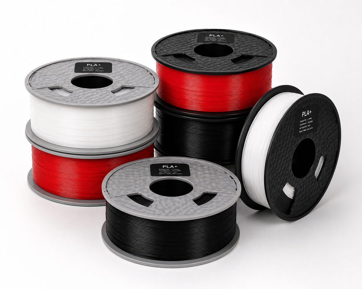 Group of red, white and black filament spools.